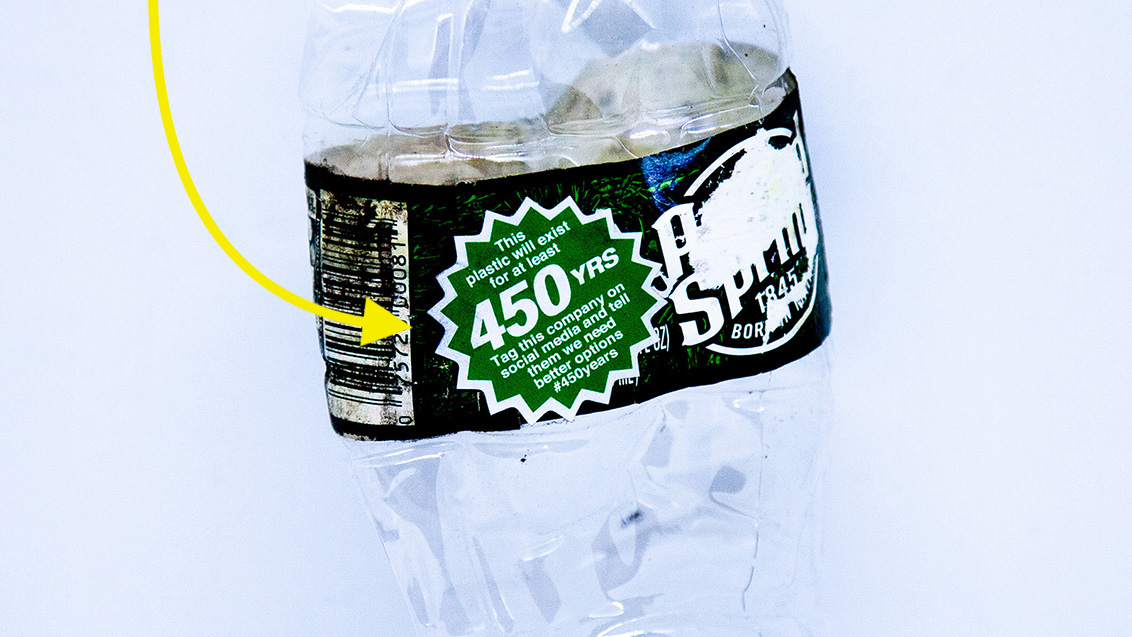 A 1.25 inch sticker on a Poland Spring bottle that says: 'This plastic will exist for at least 450 years. Tag this company on social media and tell them we need better options.''