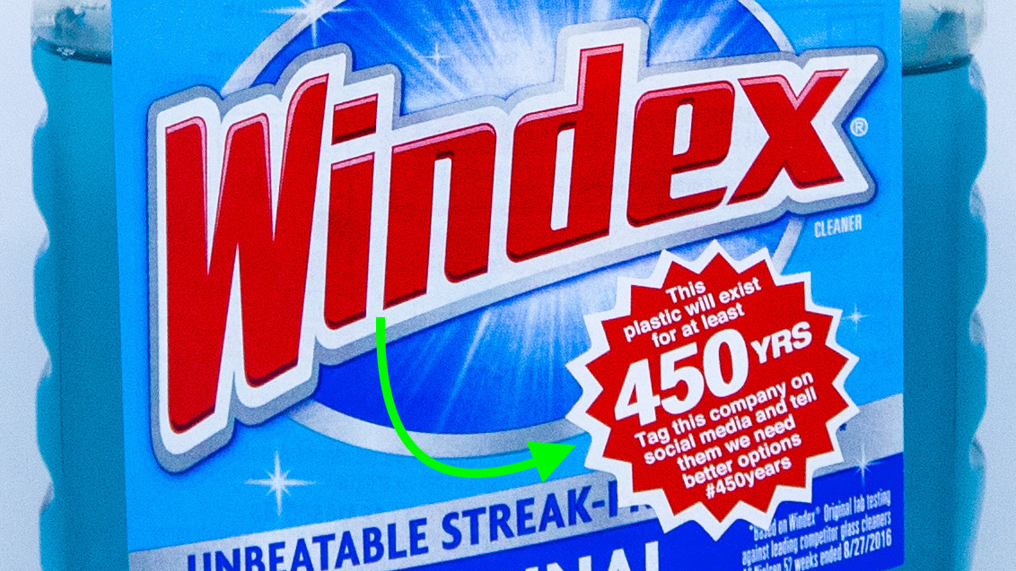 A 1.25 inch sticker on a Windex bottle that says: 'This plastic will exist for at least 450 years. Tag this company on social media and tell them we need better options.'